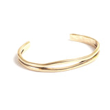 Gold bangle on a white background