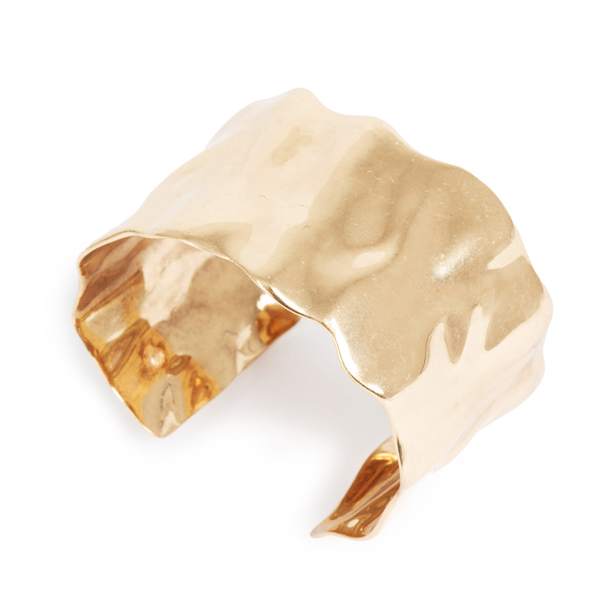 Gold cuff bracelet on a white background