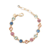 Gold bracelet with multicolored crystals on a white background