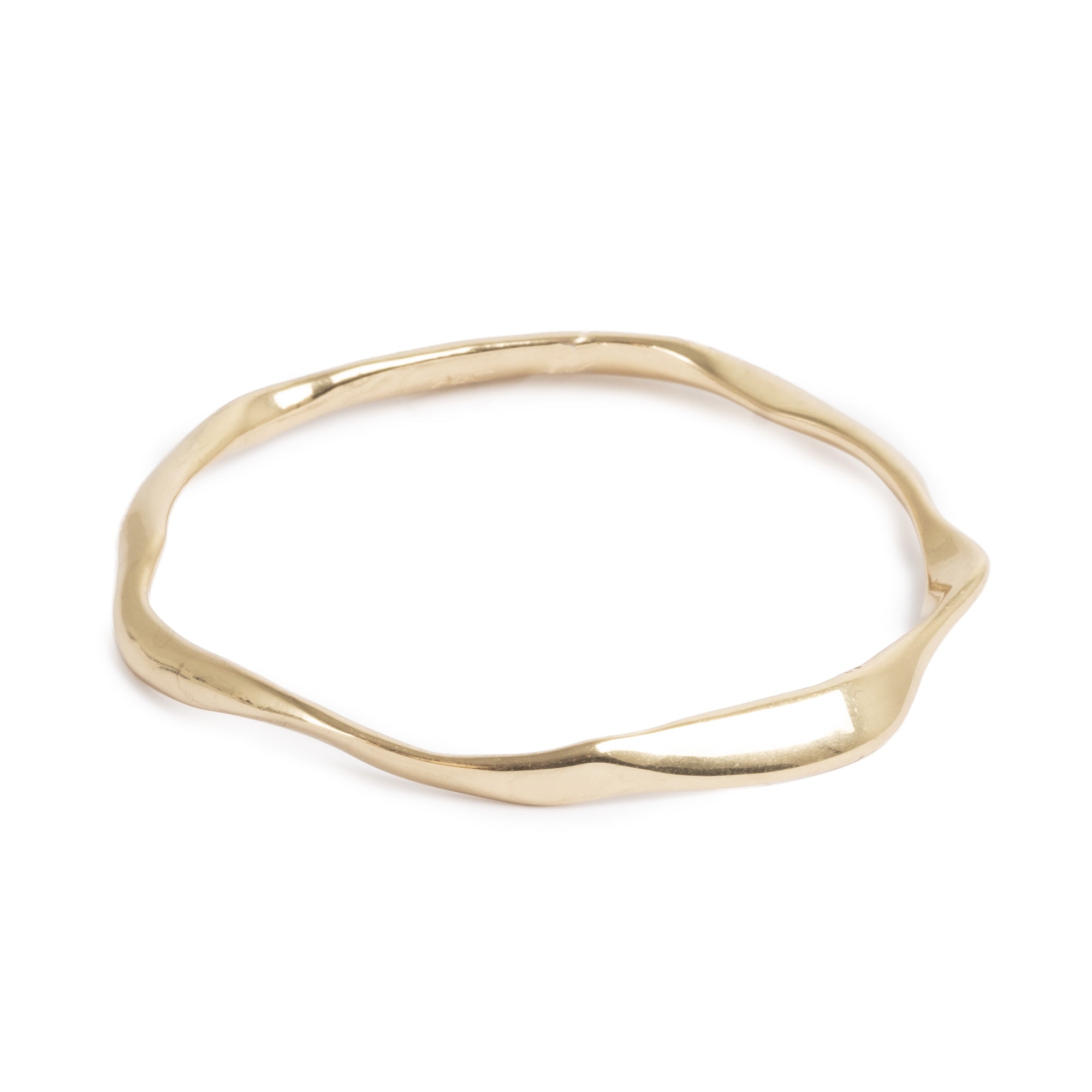 Gold irregular shaped bracelet on white background