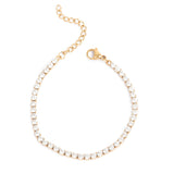 Gold bracelet with crystals on a white background