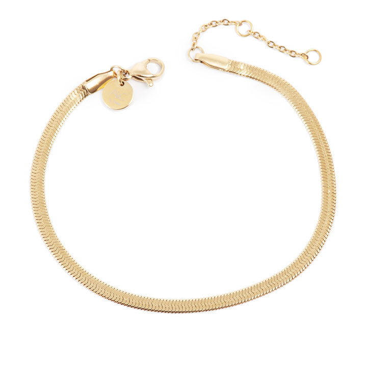 Gold bracelet on a white background