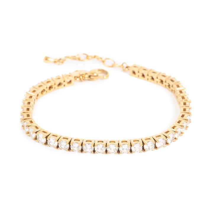 Gold bracelet with clear cyrstals on a white background