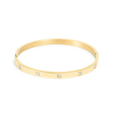 Gold bangle with zirconia crystals set into solid band