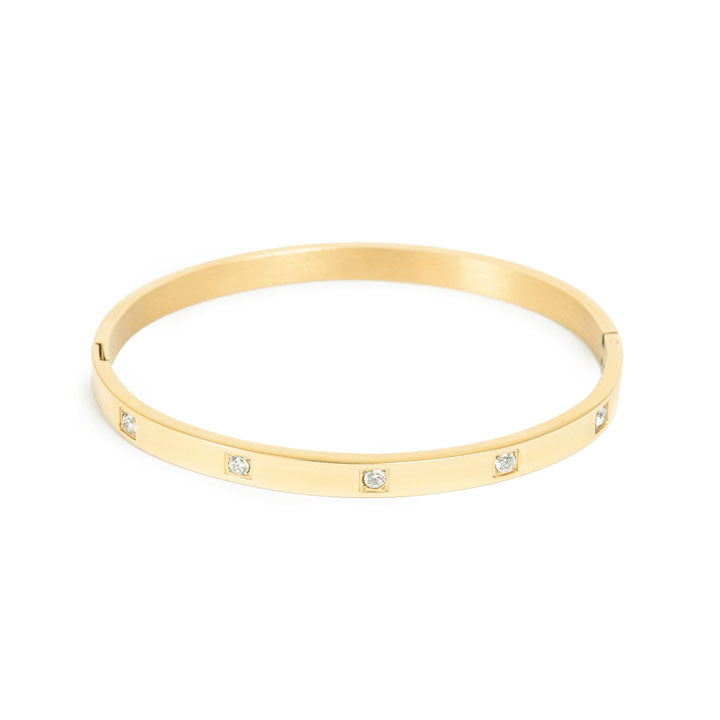 Gold bangle with zirconia crystals set into solid band