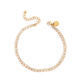 Gold braceet with small clear crystals adnd A & C branding.