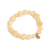Yellow tones beaded bracelet with gold charm