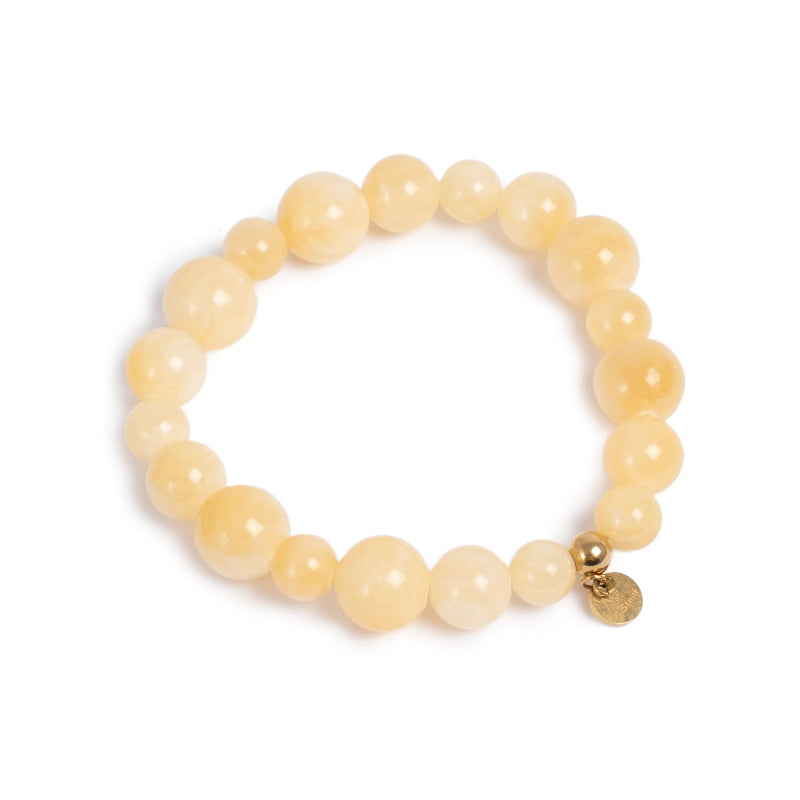 Yellow tones beaded bracelet with gold charm