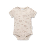 Beige baby bodysuit with animal prints on a white background