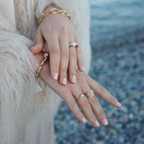 A&C Oslo Gold Bubble Heart Ring shown on model with other gold rings for a layered effect at Cerise.