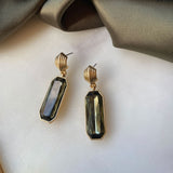 A&C Oslo Grace Collection Earrings featuring olive green coloured cut glass drops and 14Kgold plating.  These statement earrings are stunning at Cerise NZ