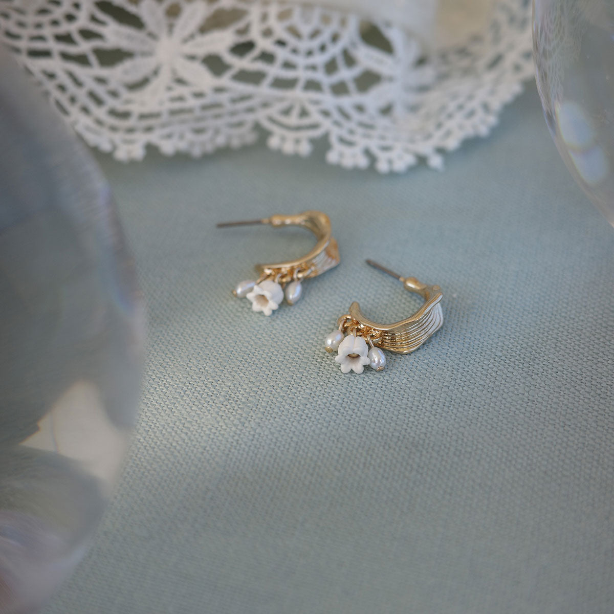 New from A&C Oslo this season, our stunning Lillies and Pearl Creol Earrings are finished 14K gold plate and feature two delicate pearls and a lilly dropping from a stunning gold creol hoop. Earring drop measures 23mm at Cerise NZ.