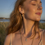New for 2026 at Cerise the A&C Oslo Solstice Gold Stud Earring with its gorgeous little opal stone and crystals from the Shimmer collection and worn here by a model is so feminine.
The Shimmer Collection features white opal stones and bohemian details to bring out the beauty in the natural and imperfect. These pieces are great to match with feminine and bohemian fashion trends and are either silver or 14K Gold plated.
Stud measures 8mm
14K gold plated steel.