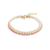 A&C Oslo Friendship bacelet from the Sweet Droplets collection, featuring beautiful pink crystals and 14K gold plate beads bound with a soft green cord.  Measures 17cm and has a 3cm extension chain at Cerise NZ.