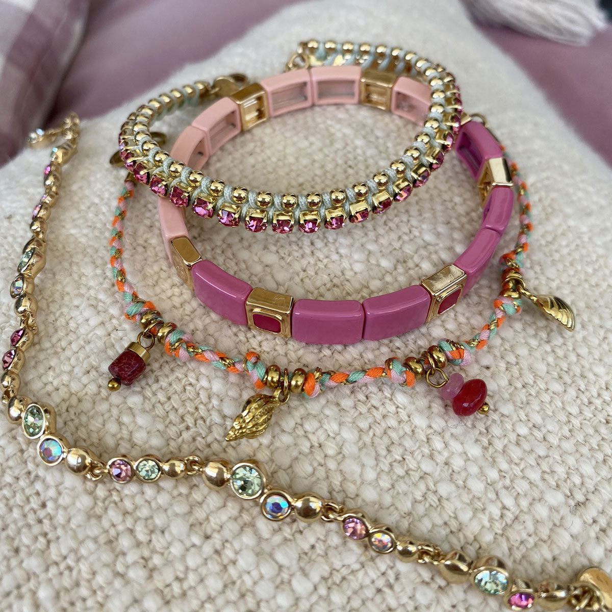 A&C Oslo Multi Stone bacelet from the Sweet Droplets collection, featuring beautiful soft multi coloured crystals and 14K gold plate beads. Shown here with a pink enamel tiles bracelet, the gorgeous new corded bracelet and colourful pink & green friendship bracelet at Cerise NZ.