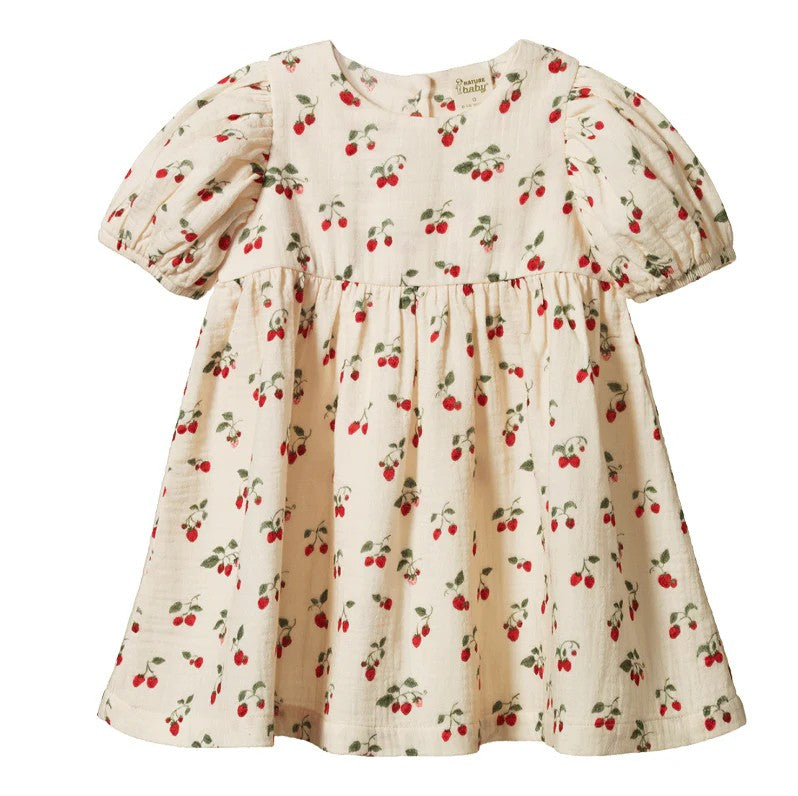 Children's dress with cherry pattern on a white background