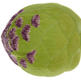 Green ceramic artichoke-shaped dish with purple floral patterns on a white background