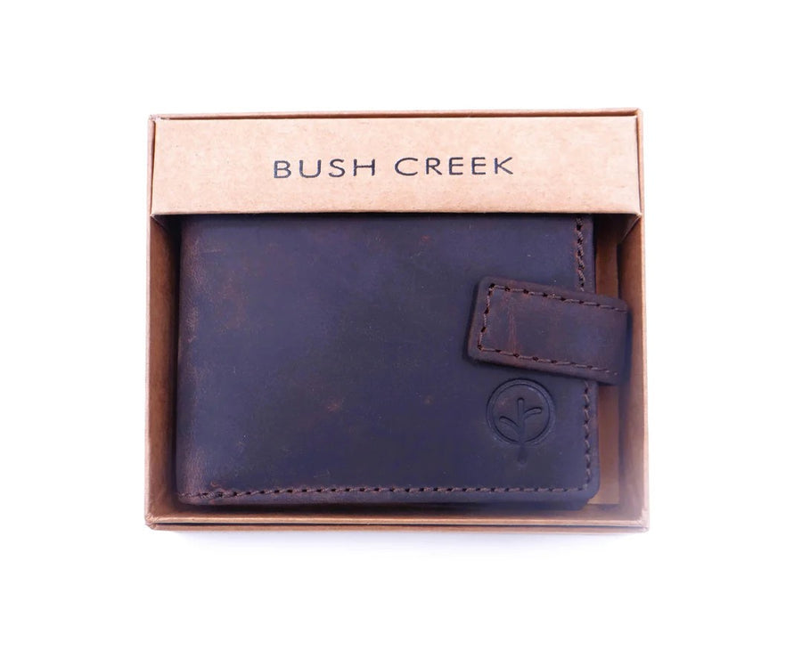 Brown leather wallet with visible brand 'Bush Creek' on a white background