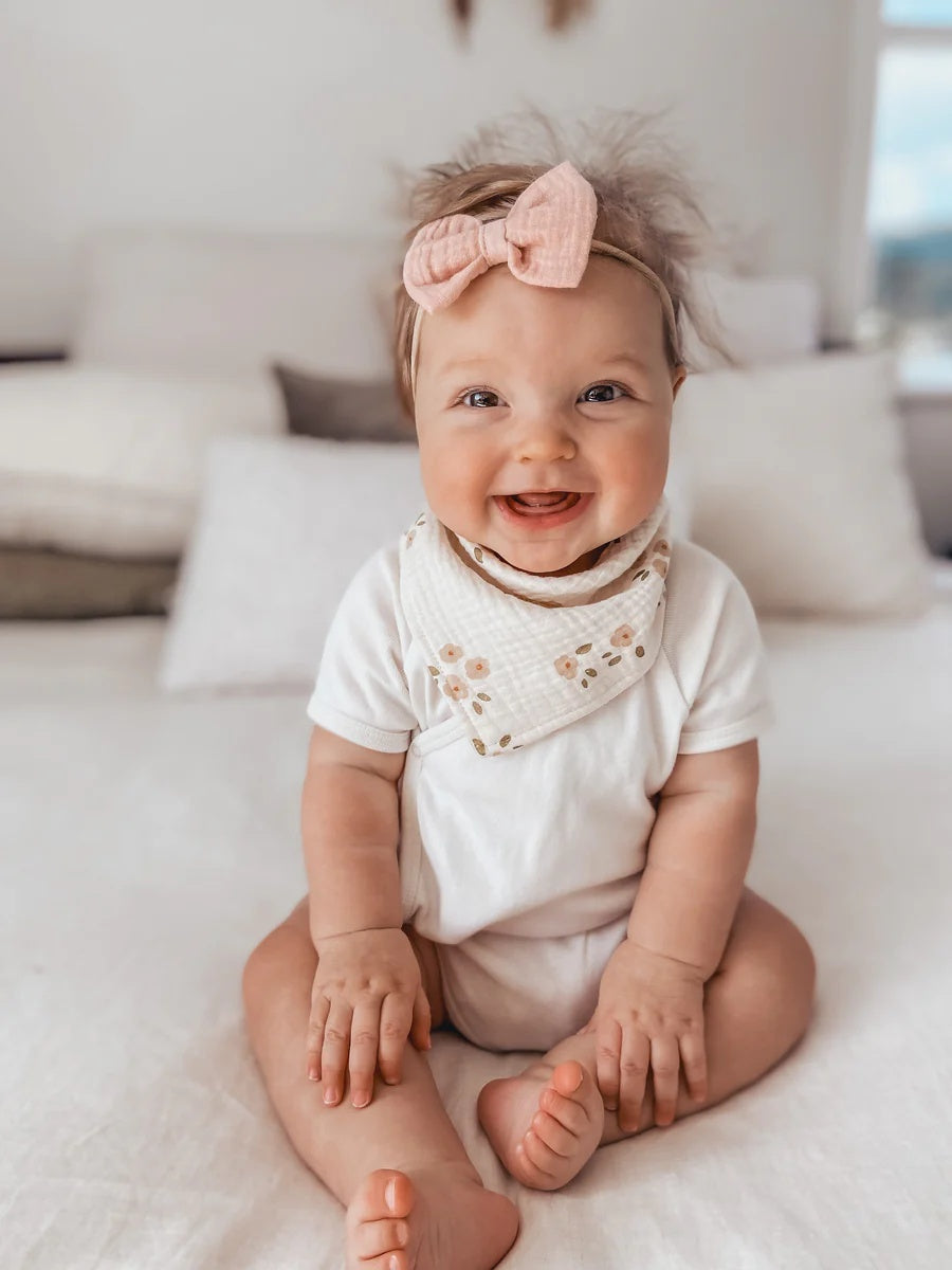 Over the Dandelions Organic Cotton Muslin Dribble Bib for baby at Cerise in Daisy print.