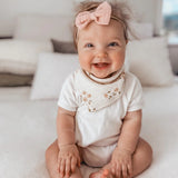 Over the Dandelions Organic Cotton Muslin Dribble Bib for baby at Cerise in Daisy print.