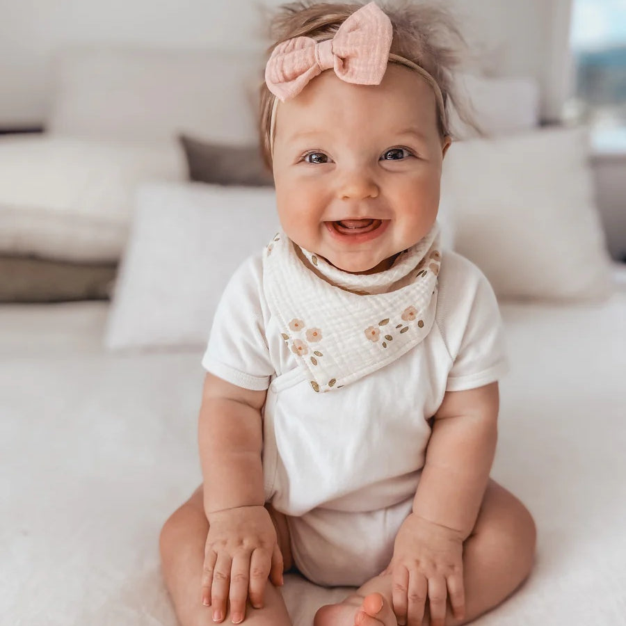 Over the Dandelions Organic Cotton Muslin Dribble Bib for baby at Cerise in Daisy print.