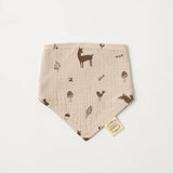 Over the Dandelions Organic Cotton Muslin Dribble Bib  for baby at Cerise in Woodlands print. A great newborn baby gift idea.