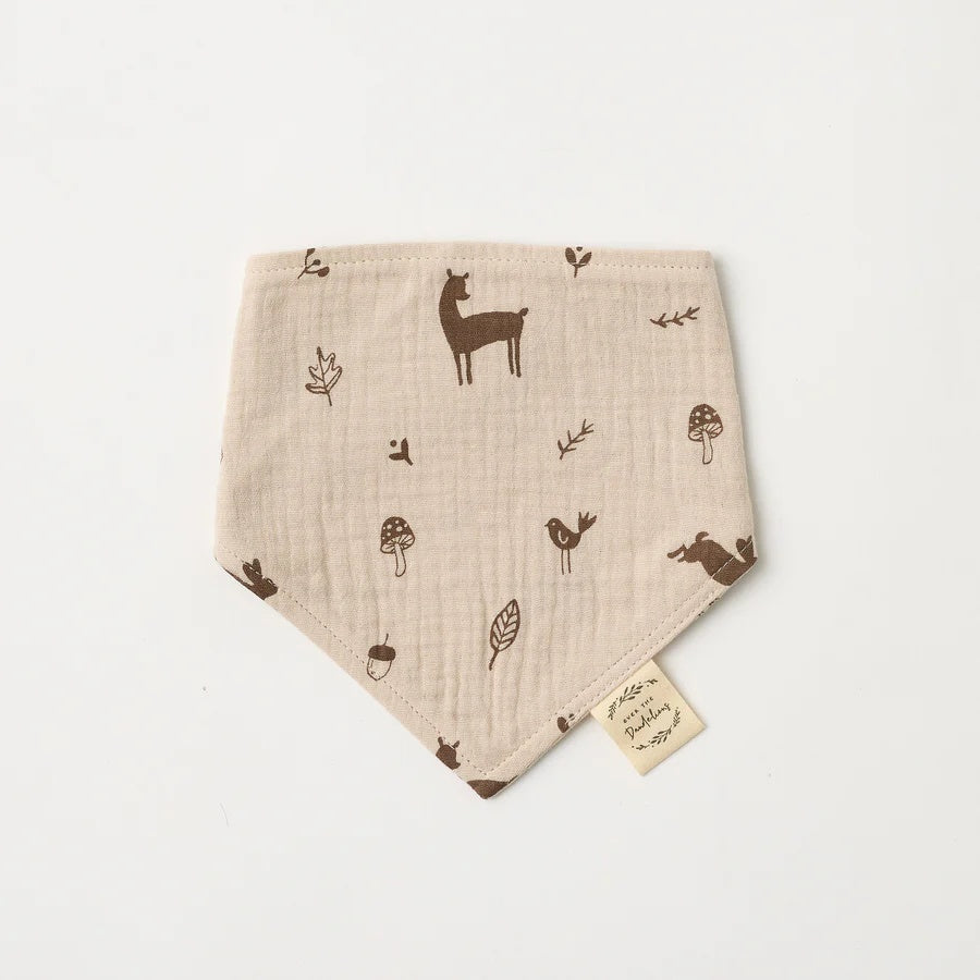 Over the Dandelions Organic Cotton Muslin Dribble Bib  for baby at Cerise in Woodlands print. A great newborn baby gift idea.