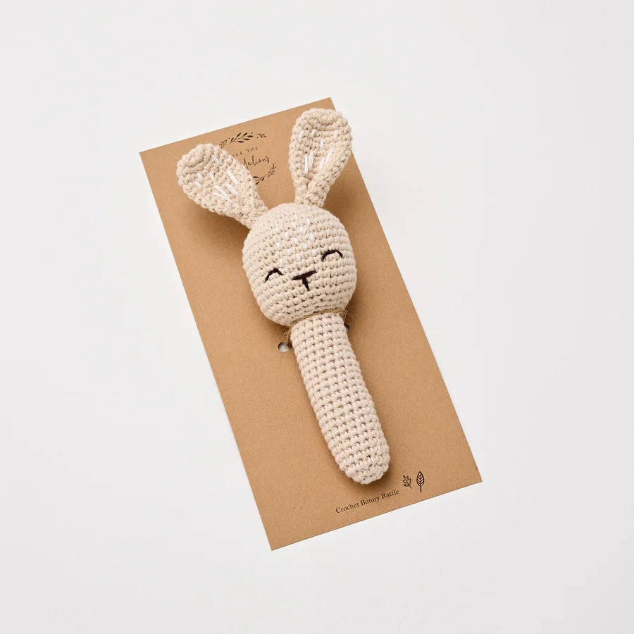 Over the Dandelions Bunny rattle at Cerise.  Crocheted from 100% cotton with polyester filling and finished in a beautiful natural sand colour.  Has a little bell inside to jingle and capture babies 