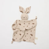 Over the Dandelions Buney Lovey in Woodlands Print at Cerise. Made from 4 layers of soft organic muslin , Bunny Lovey with floppy bunny ears will become a treasured comforter for newborns and an ideal baby shower gift.