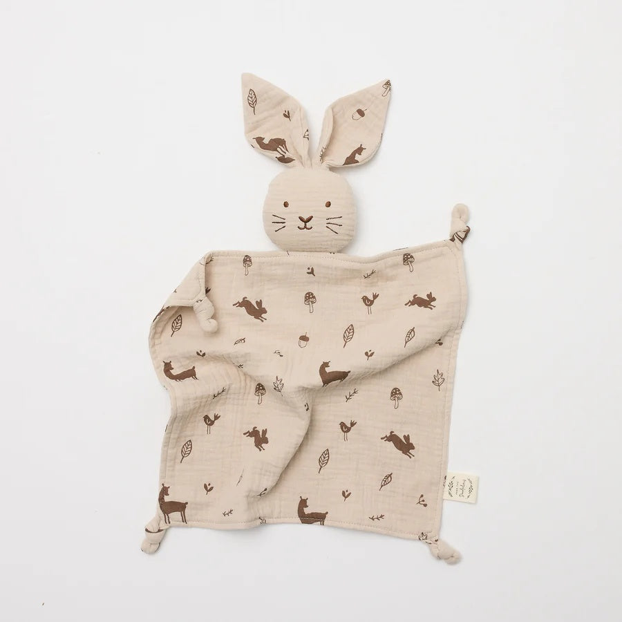 Over the Dandelions Buney Lovey in Woodlands Print at Cerise. Made from 4 layers of soft organic muslin , Bunny Lovey with floppy bunny ears will become a treasured comforter for newborns and an ideal baby shower gift.