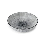 Decorative ceramic bowl with black stripe lines on a white background