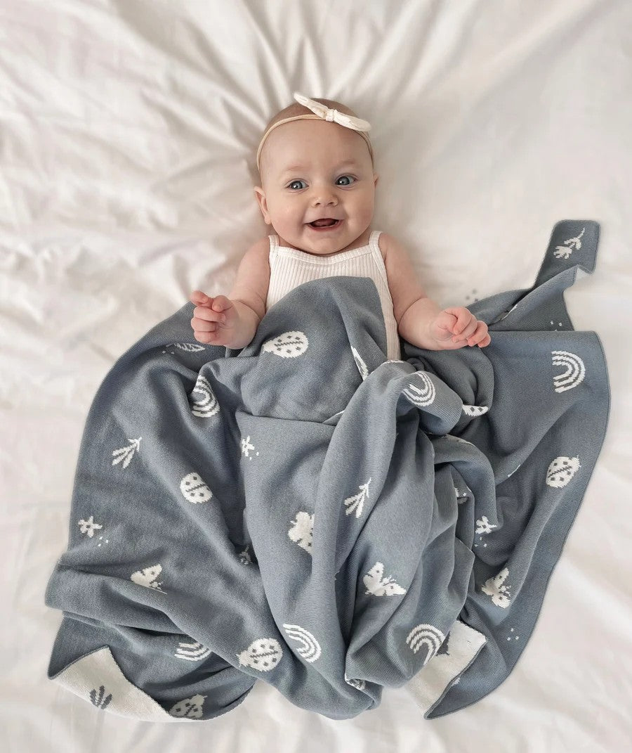 A beautiful and thoughtful newborn baby gift from Cerise, this premium knitted baby blanket in Enchanted Garden Design, is designed to be treasured for years to come. Made from certified organic cotton, it is wonderfully soft, warm, and cosy, making it perfect for keeping little ones comfortable from day one.