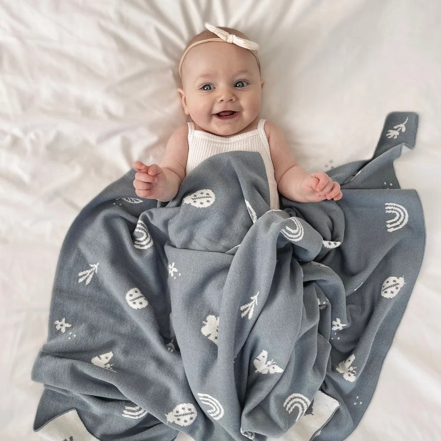 A beautiful and thoughtful newborn baby gift from Cerise, this premium knitted baby blanket in Enchanted Garden Design, is designed to be treasured for years to come. Made from certified organic cotton, it is wonderfully soft, warm, and cosy, making it perfect for keeping little ones comfortable from day one.