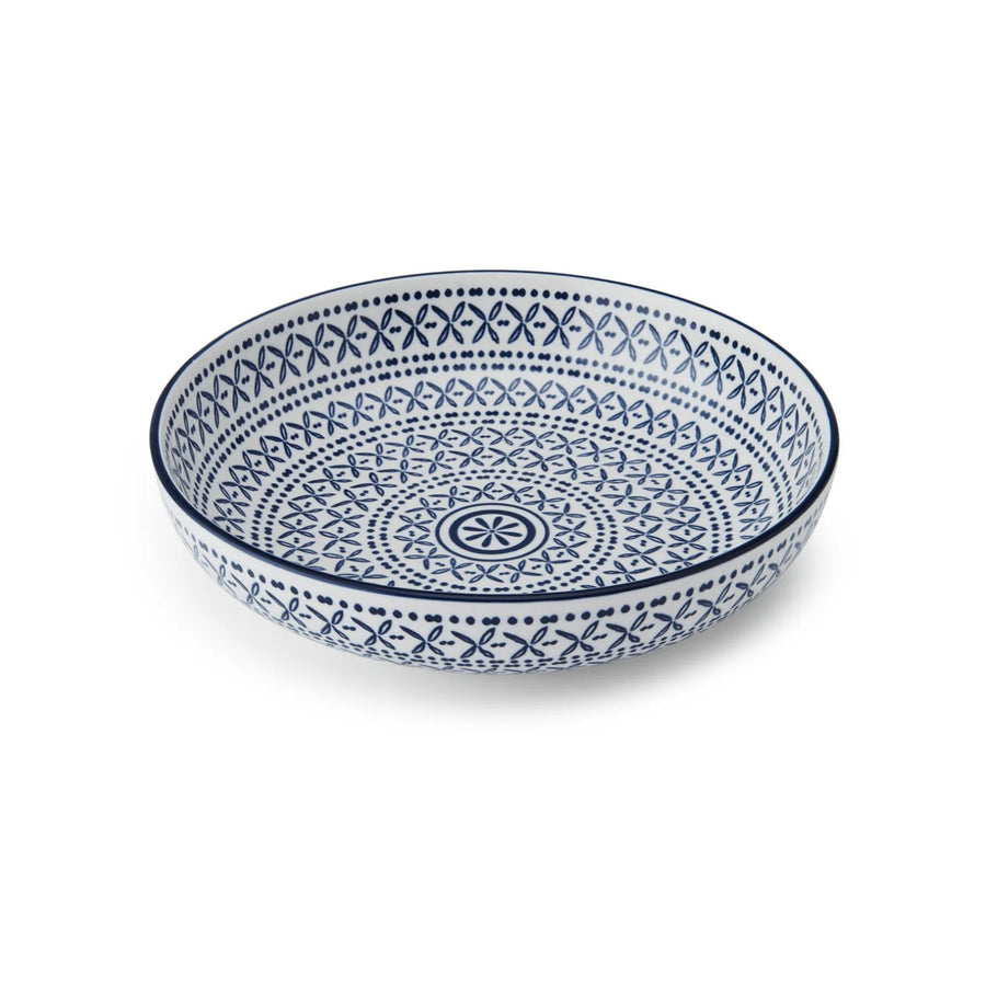 Ceramic bowl with blue geometric pattern on a white background