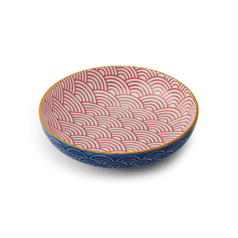 Ceramic bowl with red and blue wave pattern on a white background