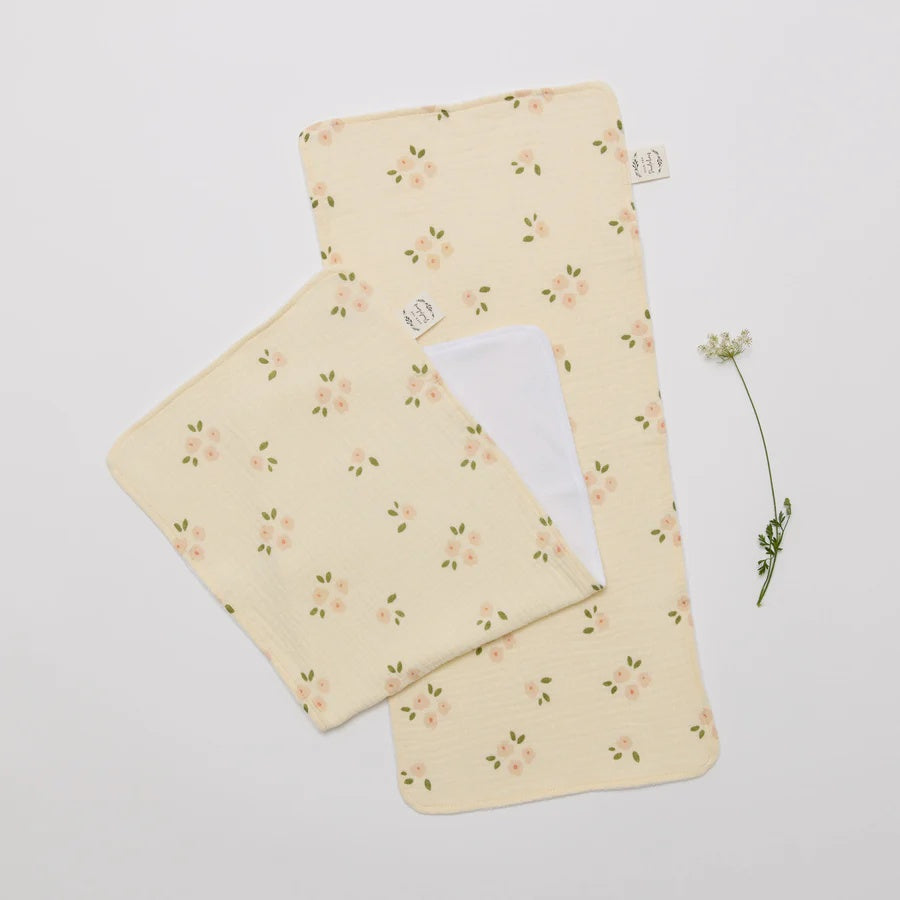 Over the Dandelions Set of 2 Burp cloths in Daisy Print at Cerise. Made from soft muslin and terry cotton so they are super soft of bbys skin.  These burp cloths are a great neborn baby gift.