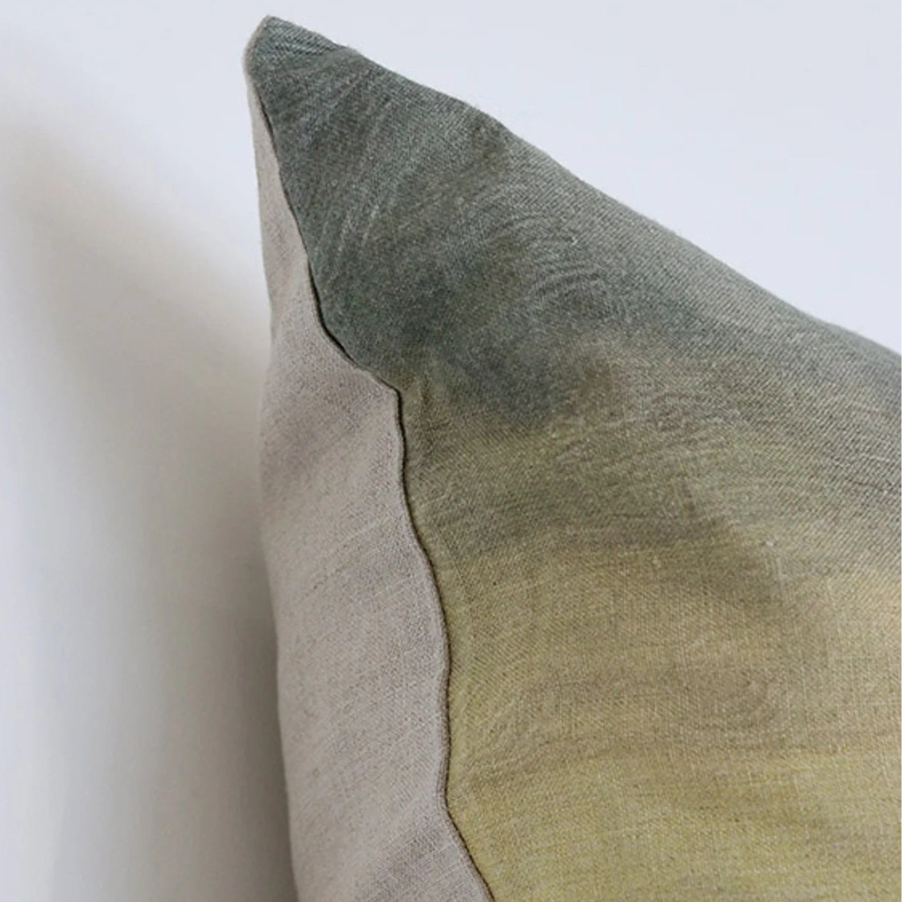 Photo showing the patterned front and plain reverse of the Island at Dusk Lumbar Cushion at Cerise
