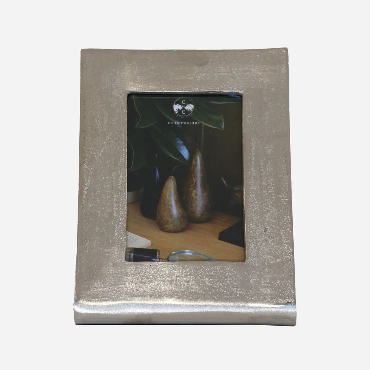 CC interiors Casablanca photo frame at Cerise.  A raw silver metal look frame holds a vertical 4x 6 inch photo.