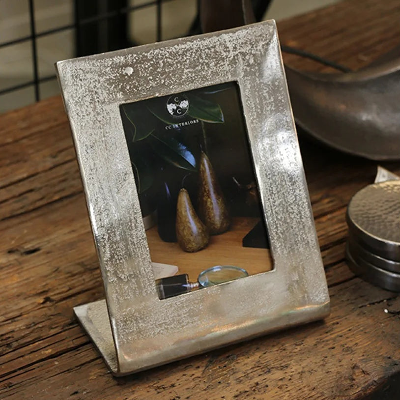 CC interiors Casablanca photo frame at Cerise.  Silver raw metal finish, holds a vertical 4x 6 inch photo.