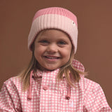 Crywolf Tasman Beanie for children  in Colourblock design availabe in either rose colour at Cerise. Its slimline, no-pom design layers easily under hoods and fits comfortably beneath bike and snow helmets. Made from super-soft Polylana® recyclable fibre, so its lightweight to wear but with the comfort of wool.