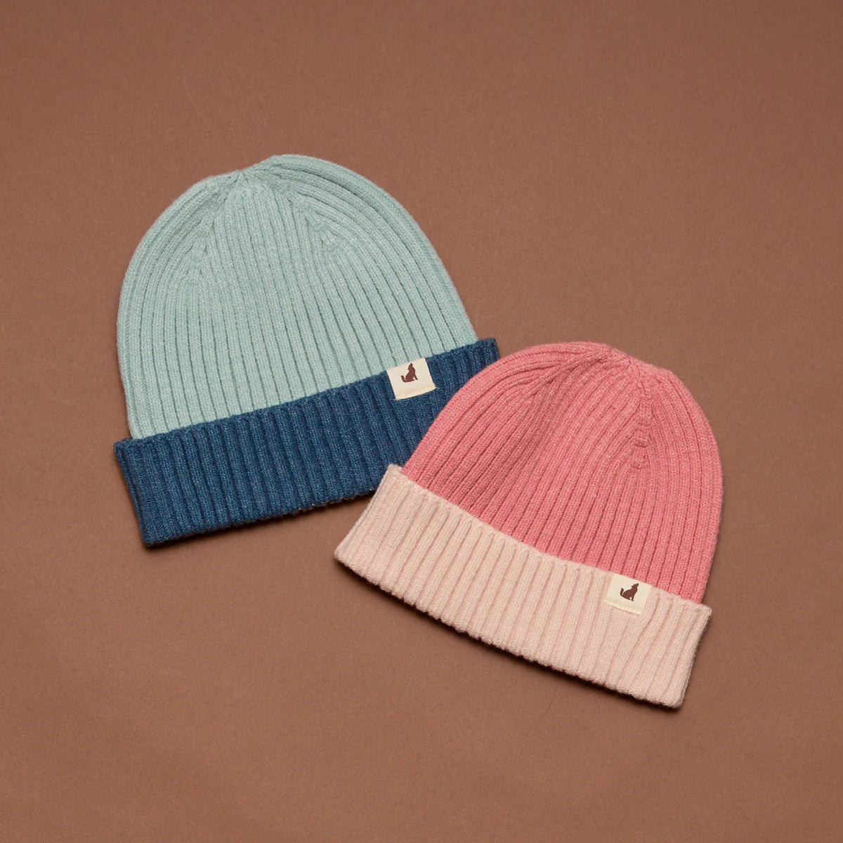 Crywolf Tasman Beanie for children  in Colourblock design availabe in either rose or blue colour at Cerise. Its slimline, no-pom design layers easily under hoods and fits comfortably beneath bike and snow helmets. Made from super-soft Polylana® recyclable fibre, so its lightweight to wear but with the comfort of wool.