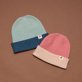 Crywolf Tasman Beanie for children  in Colourblock design availabe in either rose or blue colour at Cerise. Its slimline, no-pom design layers easily under hoods and fits comfortably beneath bike and snow helmets. Made from super-soft Polylana® recyclable fibre, so its lightweight to wear but with the comfort of wool.