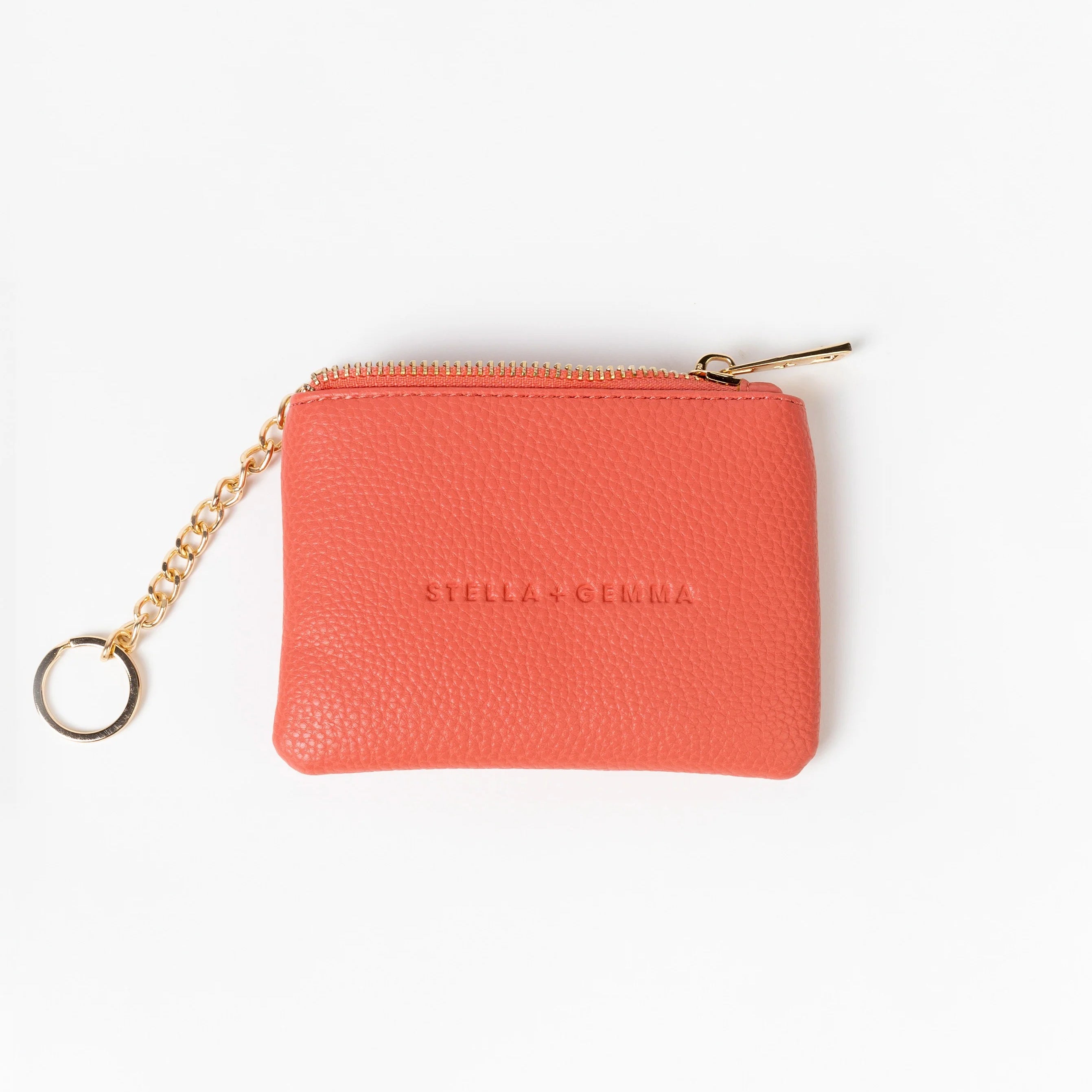 Melon coin purse with gold chain on a white background