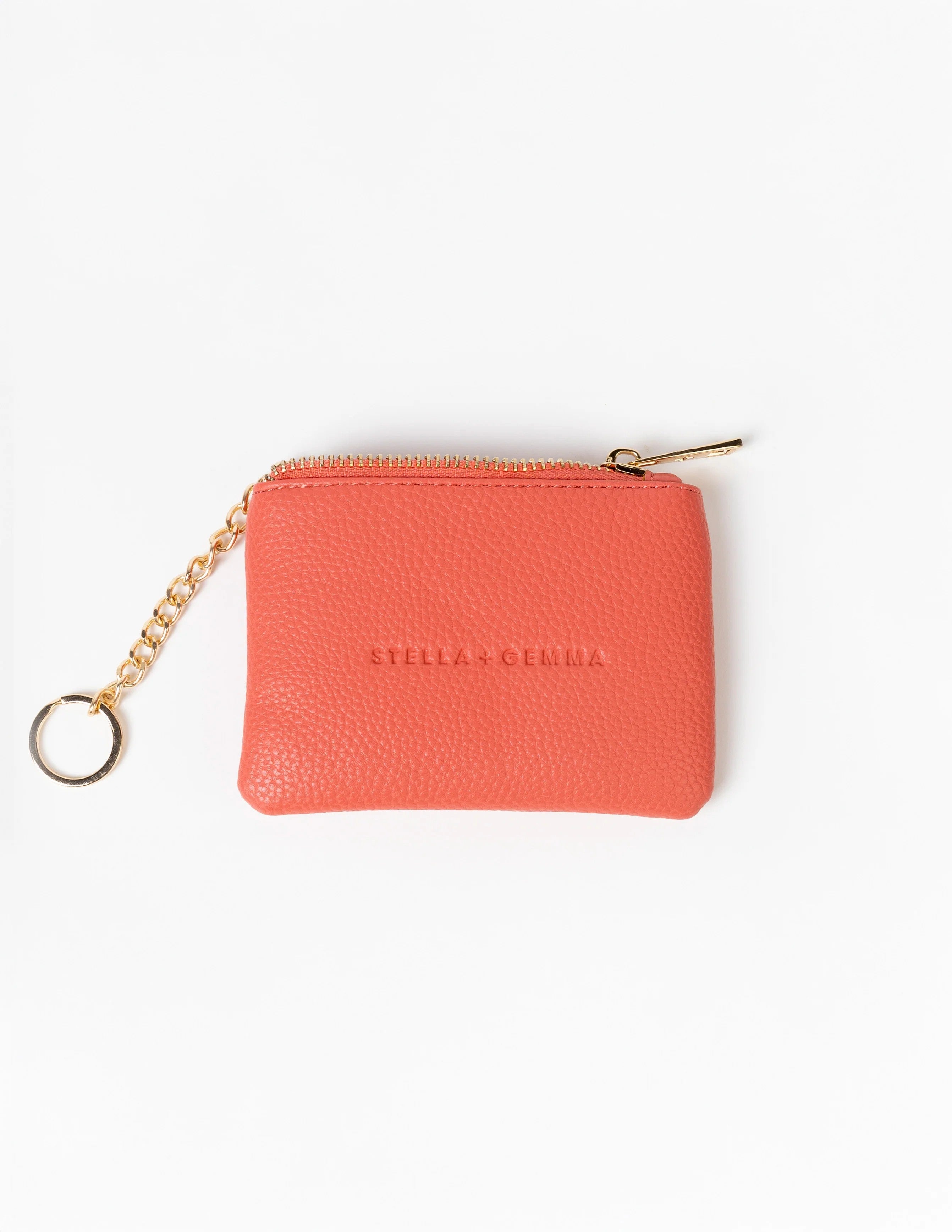 Melon coin purse with gold chain on a white background
