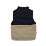 Sherpa fleece back of Crywolf reversible Yeti Vest in Ash a navy and natural colour block at Cerise. Reverses from colour block pattern on sherpa fleece side to navy on recycled polyester puffer side.