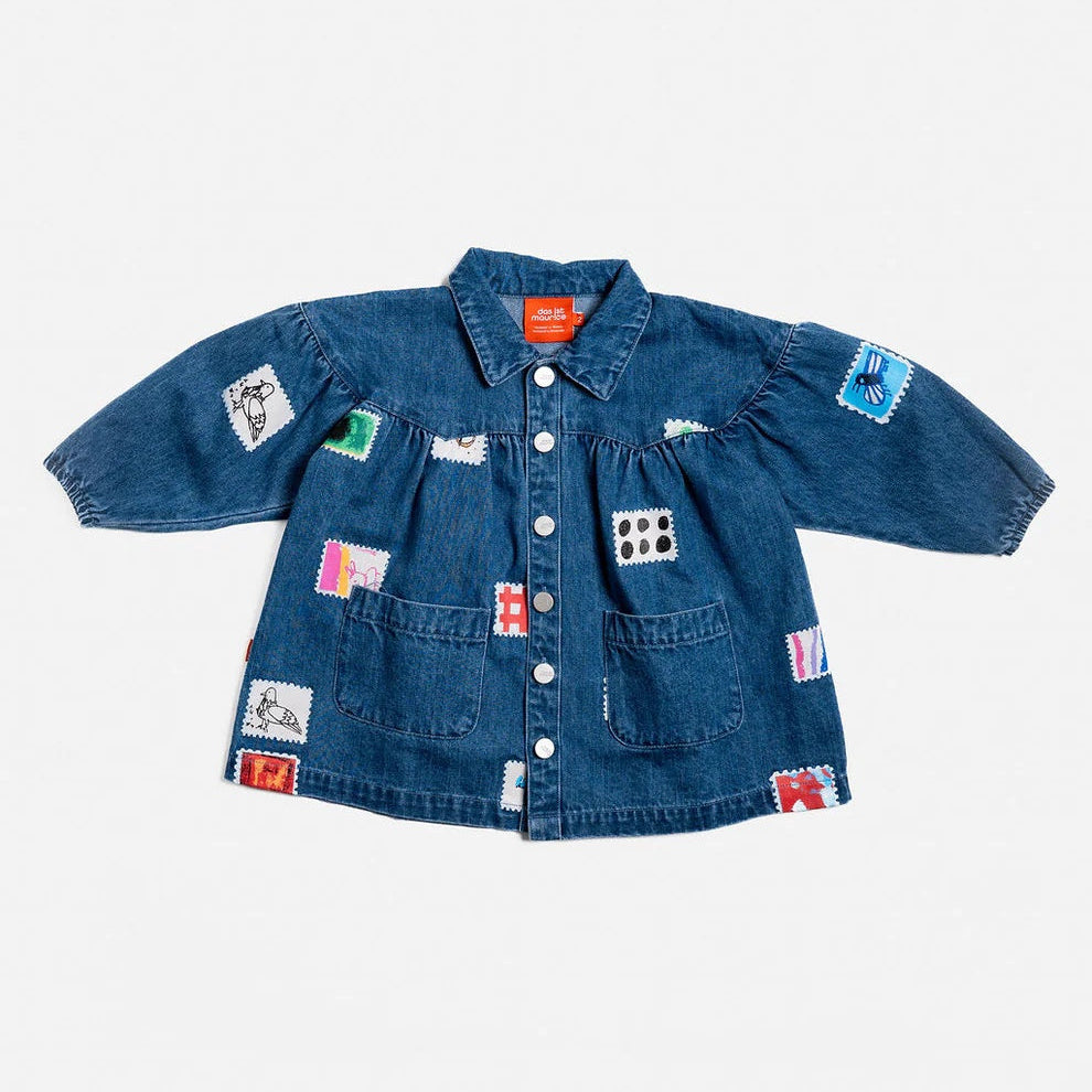 Das Ist Maurice Denim Smock Dress with long sleeves, front patch pockets, button front, collar and gathered yoke. Has a patchwork stamp pattern on the fabric at Cerise NZ