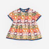 Das Ist Maurice Empire Dress in Midnight Memory print at Cerise. Featuring an exclusive geometric print inspired by treasured moments and nostalgic patterns, the Midnight Memory Dress brings a distinctive, artistic feel to a classic kids’ silhouette. The empire waist creates a relaxed, flowing shape, while the gathered skirt adds movement and plenty of room for little ones to twirl, play and explore.