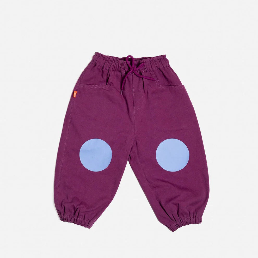 Das Ist Maurice Indogo Barrel Pants in Blueberry with elastic drawstring waist, elastic cuffs and blue circle knee patch at Cerise NZ.