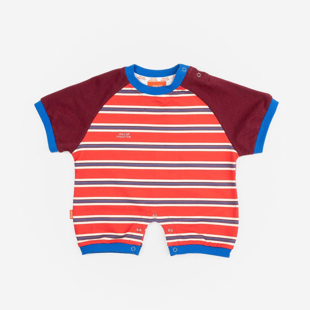 Das Ist Maurice Romper in sunset design featuring bright red and blue striped body with contrast burgundy sleeves bound in a bright blue.  A sporty look for babies and toddlers at Cerise.