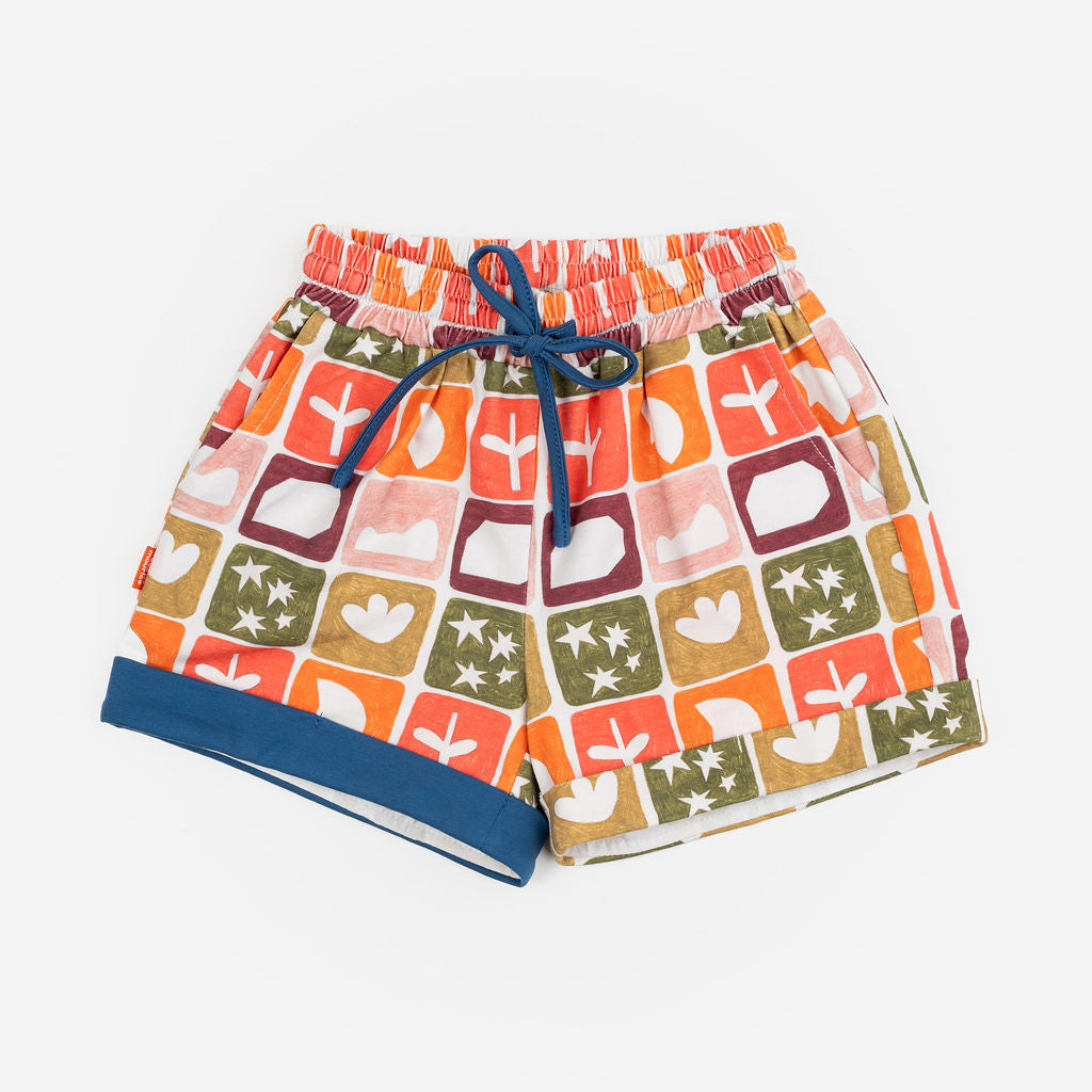 Das Ist Maurice Shorts in Midnight pattern at Cerise. Featuring an exclusive hand-illustrated Midnight Memory print, these kids’ shorts bring an artistic and imaginative feel to a classic everyday style. A contrasting navy drawstring adds a bold finishing detail, while rolled cuffs give the shorts a relaxed, playful look.